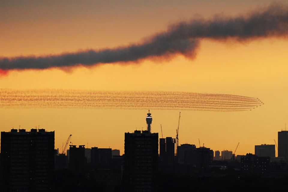 LONDON, ENGLAND - JULY 27:  The Red Arrows disappear over London ahead of the Opening Ceremony of the 2012 London Olympic Games at the Olympic Park on July 27, 2012 in London, England.  (Photo by Mike Hewitt/Getty Images)