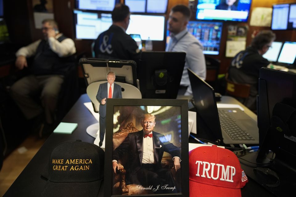 Paraphernalia supporting US President Donald Trump is displayed at a post on the floor of the New York Stock Exchange in New York (Seth Wenig/AP)