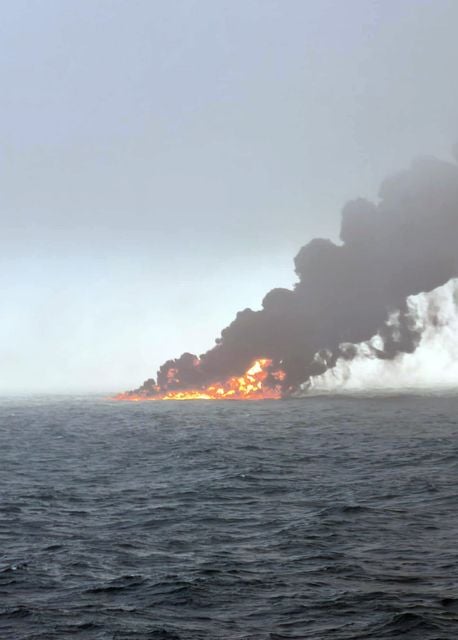 Black smoke billowing into the air after a crash between an oil tanker and a cargo ship off the coast of East Yorkshire (Bartek Smialek/PA)