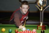 thumbnail: The young star player in 2004 with his World Championship trophy back in his local snooker hall in Antrim