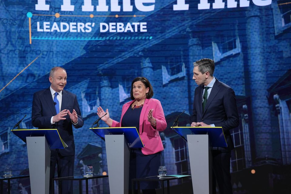 Mr Martin, Ms McDonald and Mr Harris during the final leaders’ debate (Niall Carson/PA)