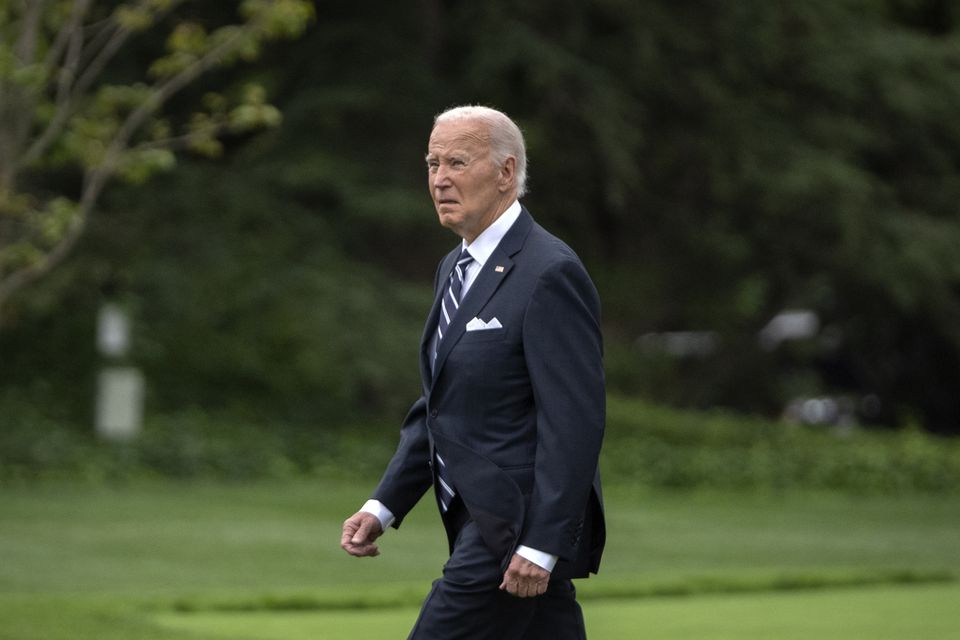 President Joe Biden walks out of the White House to board Marine One on the South Lawn in Washington (Mark Schiefelbein/AP)