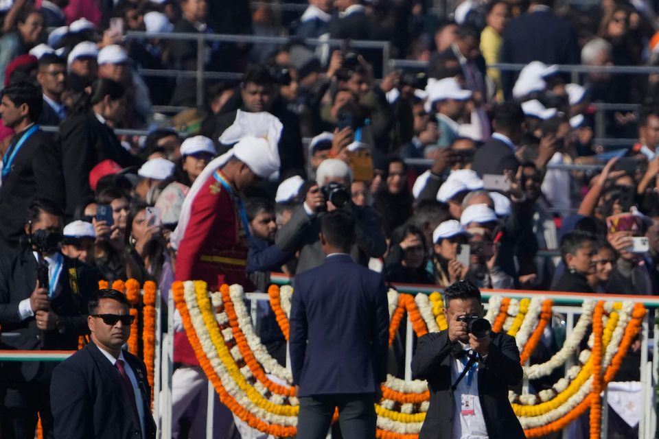 Indian Prime Minister Narendra Modi waves as he arrives for the parade (Channi Anand/AP)