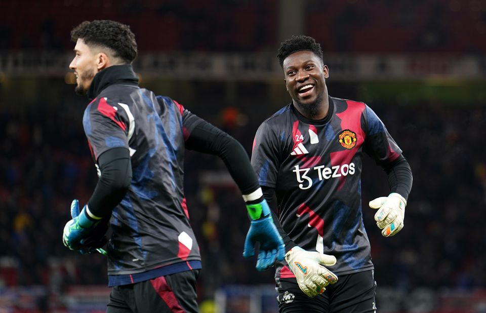 Altay Bayindir, left, got the start against Rangers after Andre Onana’s mistake against Brighton (Martin Rickett/PA)