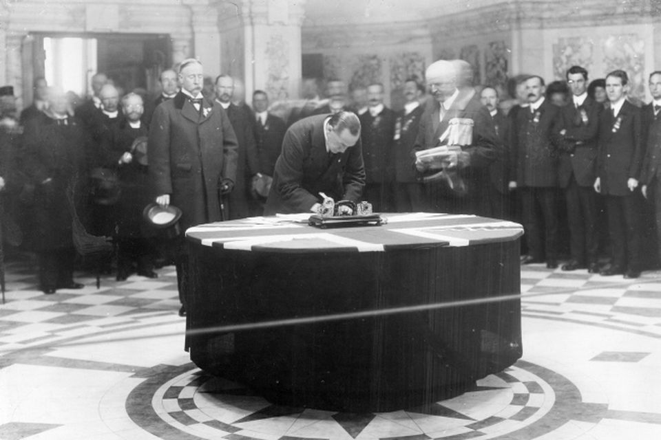 Sir Edward Carson signing the Ulster Covenant at Belfast City Hall.  28/9/1912
