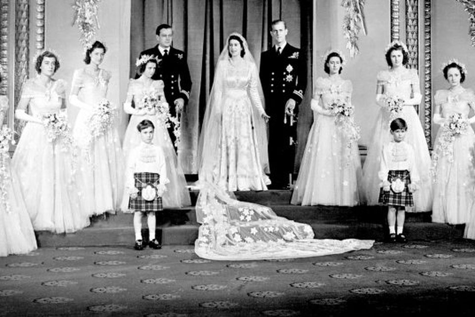 20/11/1947 Princess Elizabeth, now Queen, and Lieutenant Philip Mountbatten, now the Duke of Edinburgh with their eight bridesmaids in the Throne Room at Buckingham Palace, on their wedding day.