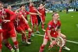 thumbnail: Chris Curran prepares to lift the Irish Cup in front of his Cliftonville team-mates
