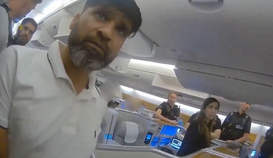 Screen grab from body cam footage of the moment police officers boarded a plane and detained Urfan Sharif and Beinash Batool (Surrey Police/PA)