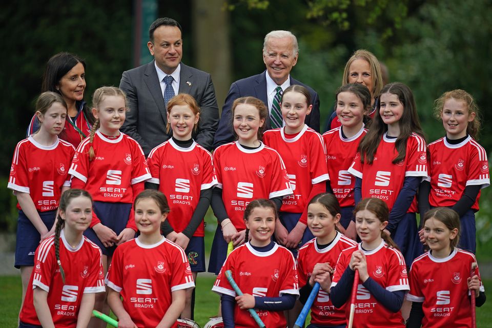 US President Joe Biden and Taoiseach Leo Varadkar with camogie players at Farmleigh House, Dublin (Niall Carson/PA)