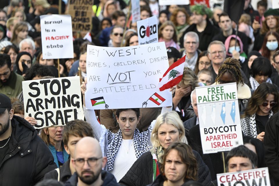 A silent march was held to commemorate all civilians killed (Lesley Martin/PA)