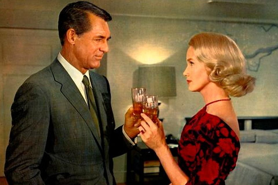 Cary Grant and Eva Marie Saint clink glasses in North by Northwest