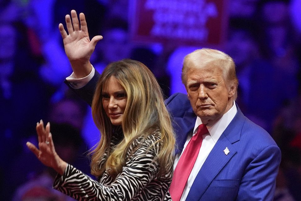 Donald Trump and his wife Melania at a campaign rally in New York Evan Vucci/AP)