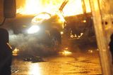 thumbnail: A burned out car during disturbances which erupted in east Belfast