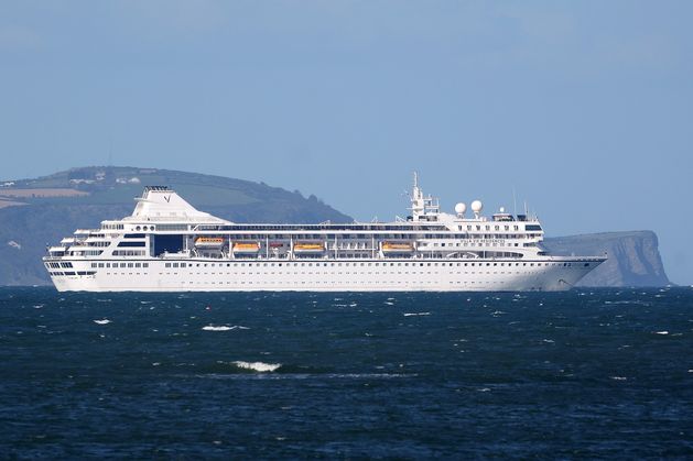 ‘Conflicting reports’ as stranded cruise ship remains in Belfast for another day