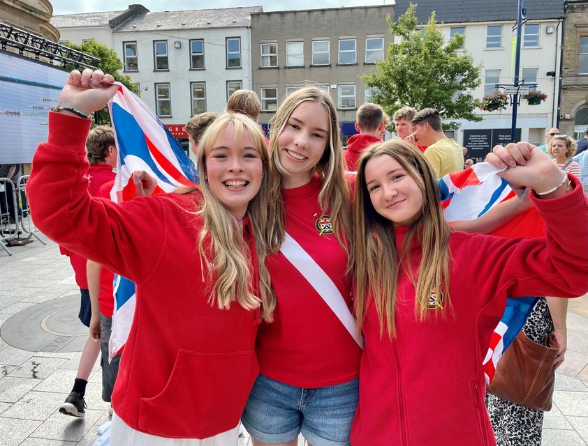 Members of Bann Rowing Club, (left to right) 15 year old Hannah Nicholl, Lydia Quigley and Erin McAleer in the centre of Coleraine at an Olympic big screen watch-along event for the final of the women’s quadruple sculls (David Young/PA)