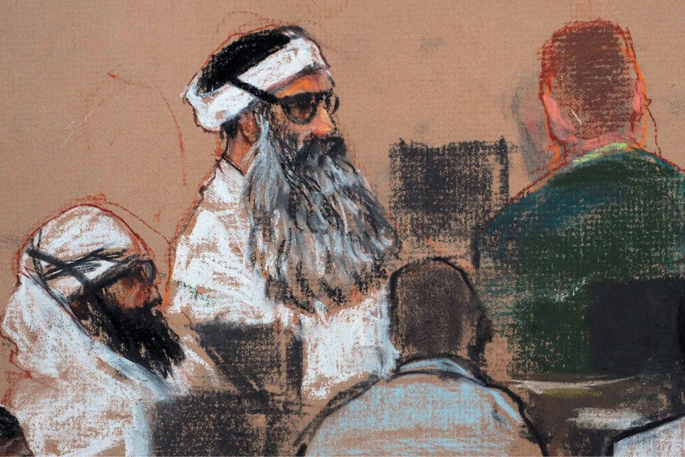 Khalid Sheikh Mohammed, center, and co-defendant Walid Bin Attash, left, attending a pre-trial session at Guantanamo Bay Naval Base, Cuba (Janet Hamlin/AP)