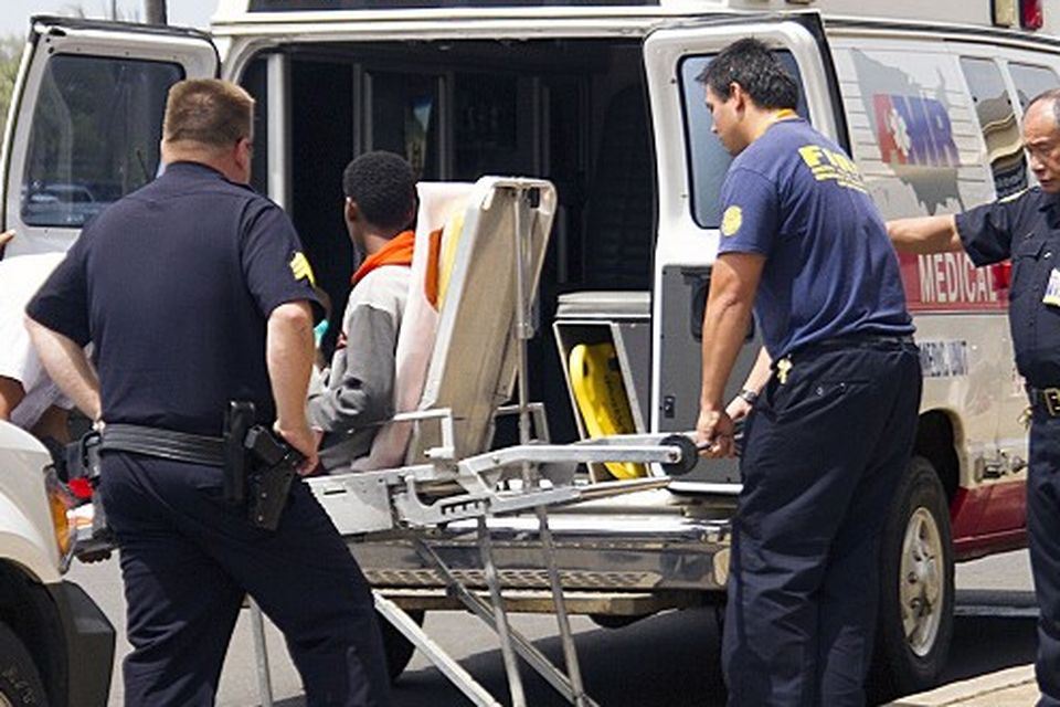 A 15-year-old boy who stowed away in the wheel well of a flight from San Jose, California, to Maui, is put into an ambulance at Kahului Airport (AP/The Maui News)