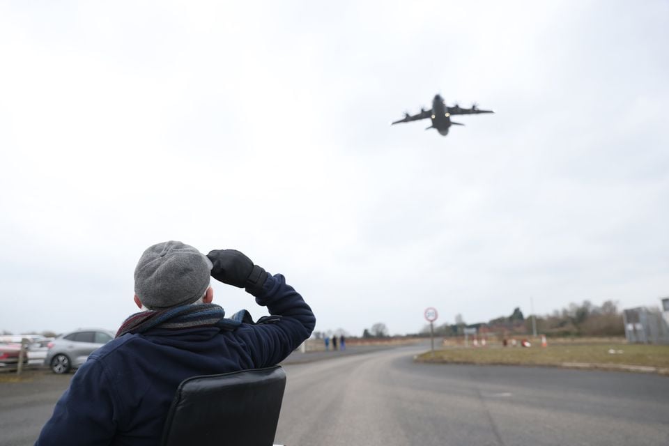 Fred Jennings salutes as the huge Atlas RAF transport plane passes overhead (Photo by Peter Morrison)