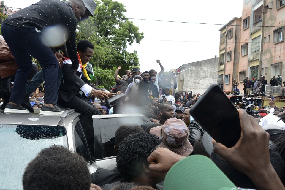 Mr Mondlane addressed supporters from the top of a vehicle in Maputo (Carlos Uqueio/AP)