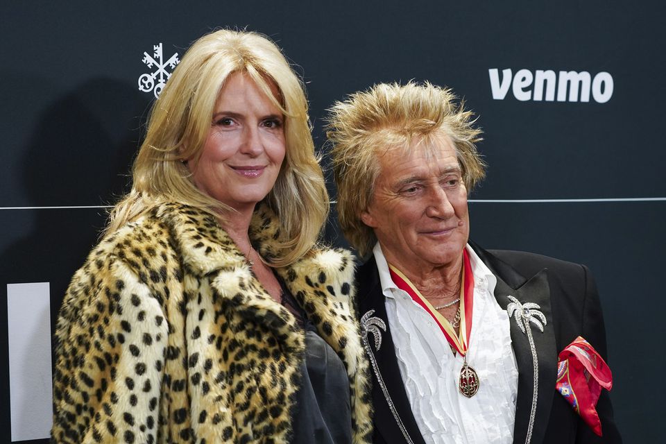 Penny Lancaster, left, and Rod Stewart arrive at the FireAid benefit concert  (Jordan Strauss/Invision/AP)