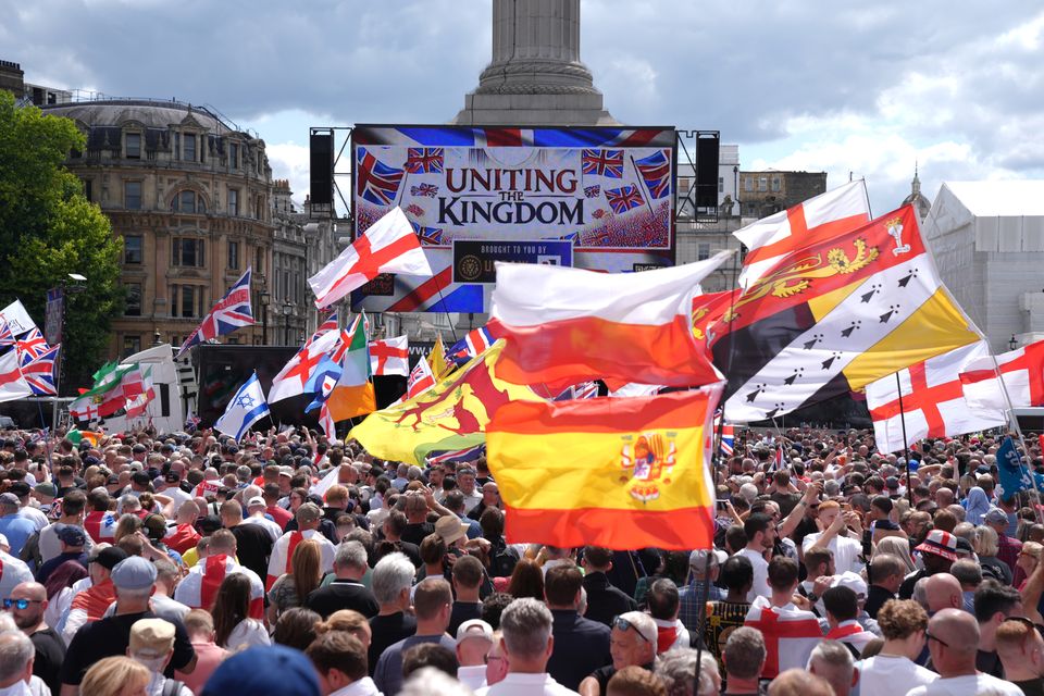 People gather at Trafalgar Square during a rally organised by Tommy Robinson (Maja Smiejkowska/PA)