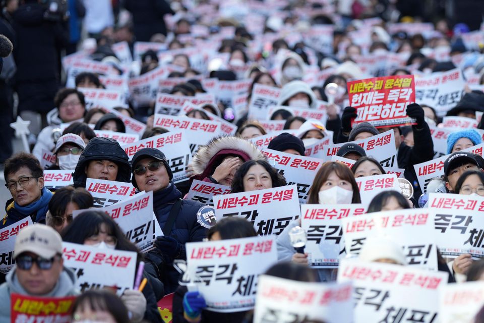 Participants shout slogans during a rally calling on the Constitutional Court to dismiss the President Yoon Suk Yeol in Seoul, South Korea (Lee Jin-man/AP)