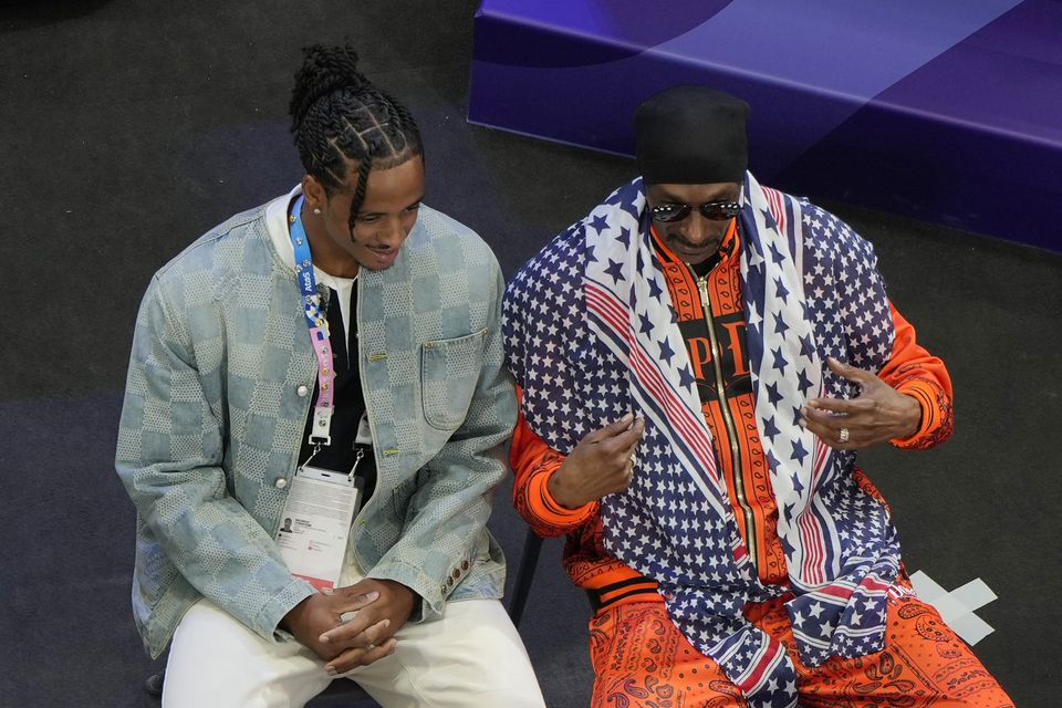 Snoop Dogg, right, attends the men’s team Foil quarterfinal at the Paris 2024 Summer Olympics (Andrew Medichini/AP)