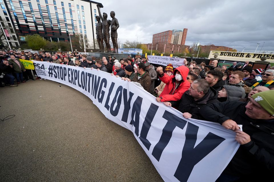 Manchester United fans protest against ticket pricing ahead of the game (Martin Rickett/PA)