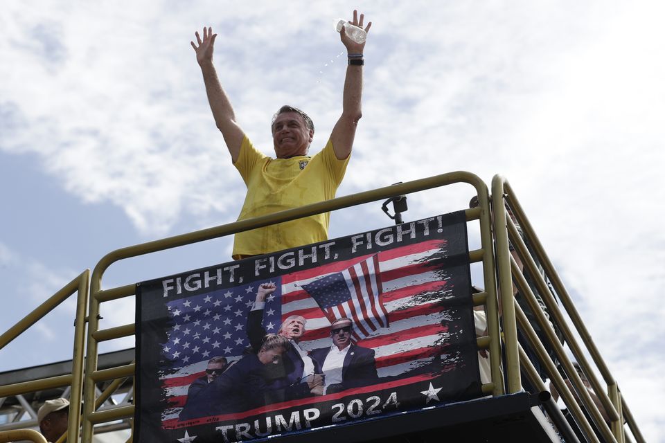 Brazil’s former president Jair Bolsonaro gestures to the crowd at the rally (Bruna Prado/AP)