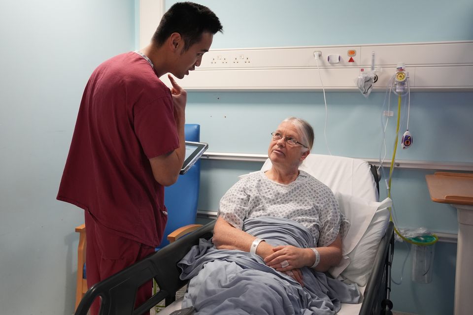 Natalie Boller (right) with consultant ENT and sleep surgeon Ryan Chin Taw Cheong (Lucy North/PA)