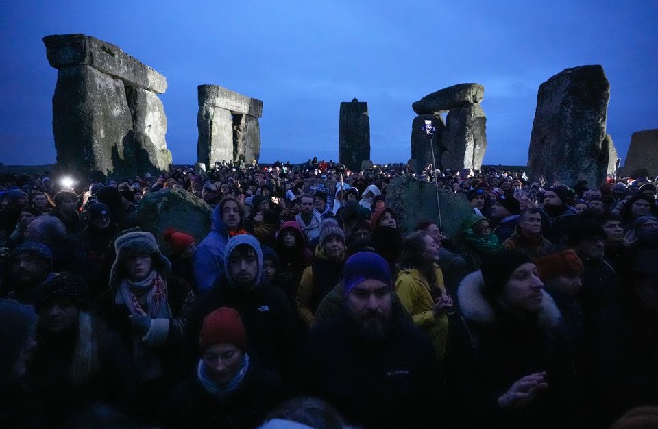 People wait for the sunrise (Andrew Matthews/PA)