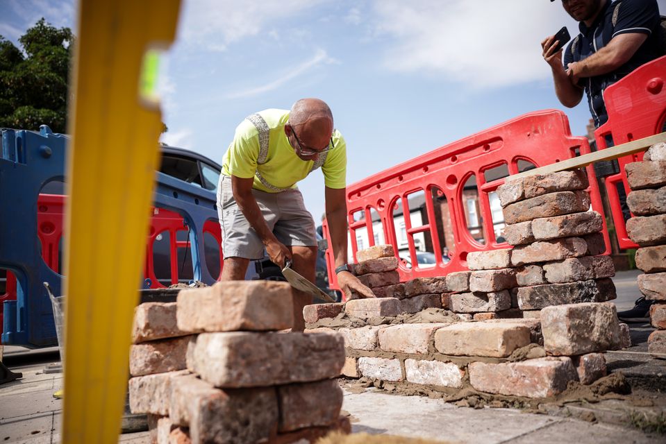 Local tradesmen rebuilt walls outside the mosque in Southport after the protests (James Speakman/PA)