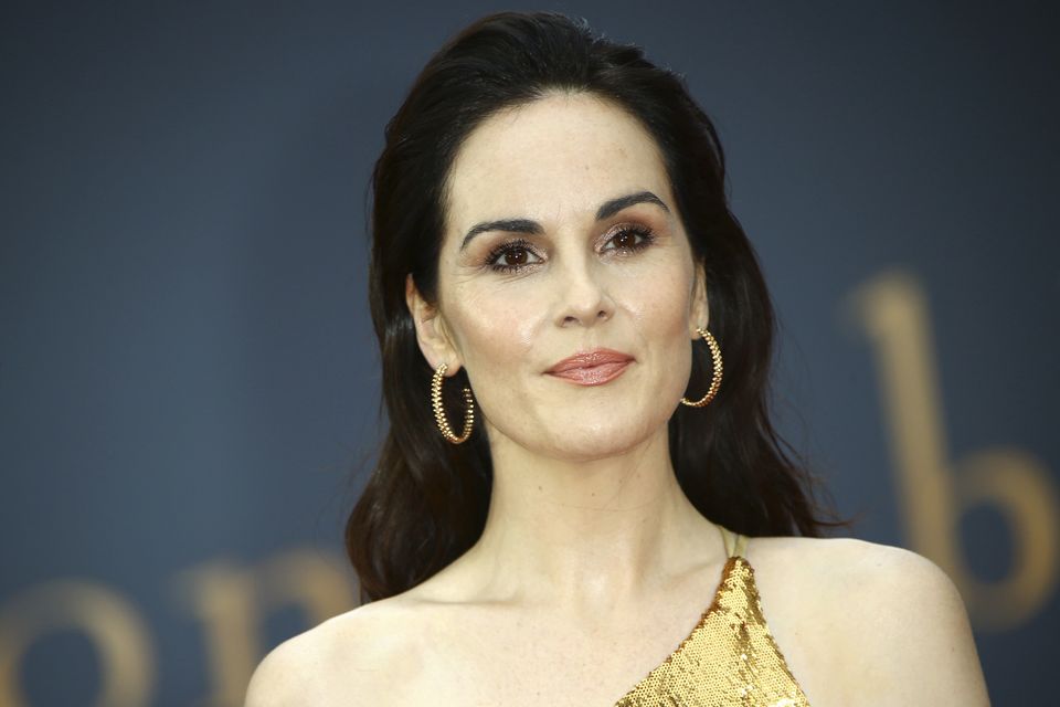 Michelle Dockery dazzles on Downton Abbey red carpet