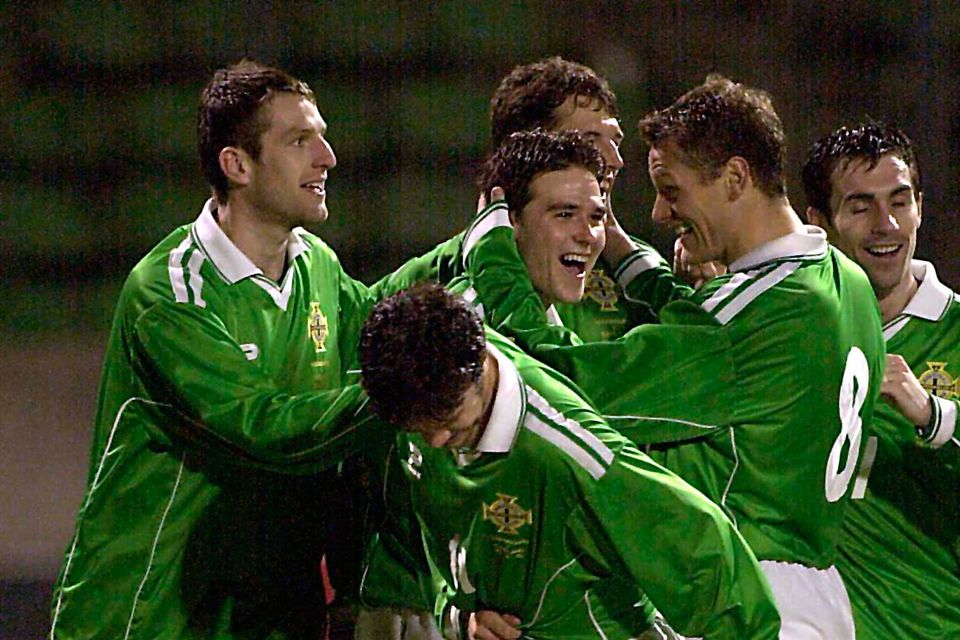 Jim Magilton congratulates David Healy on the second of his debut goals for Northern Ireland
