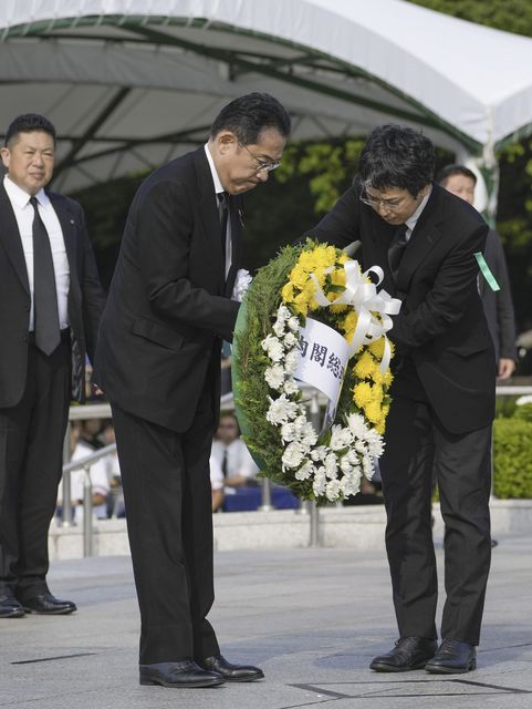 Japan’s Prime Minister Fumio Kishida prepares to lay a wreath at the cenotaph dedicated to the victims of the atomic bombing (Kai Naito/AP)