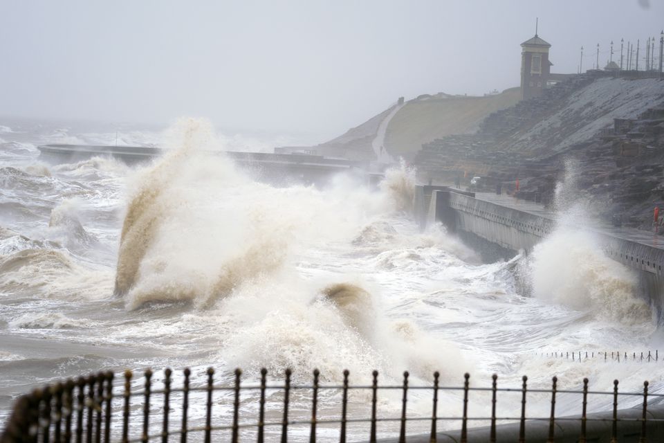 Waves break on the seafront in Blackpool, as snow, rain and wind warnings are in force and are expected to cause travel issues across the country (Peter Byrne/PA)