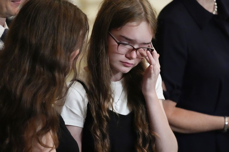 Alsu Kurmasheva’s daughter wiped away a tear during Mr Biden’s White House address (AP Photo/Alex Brandon)