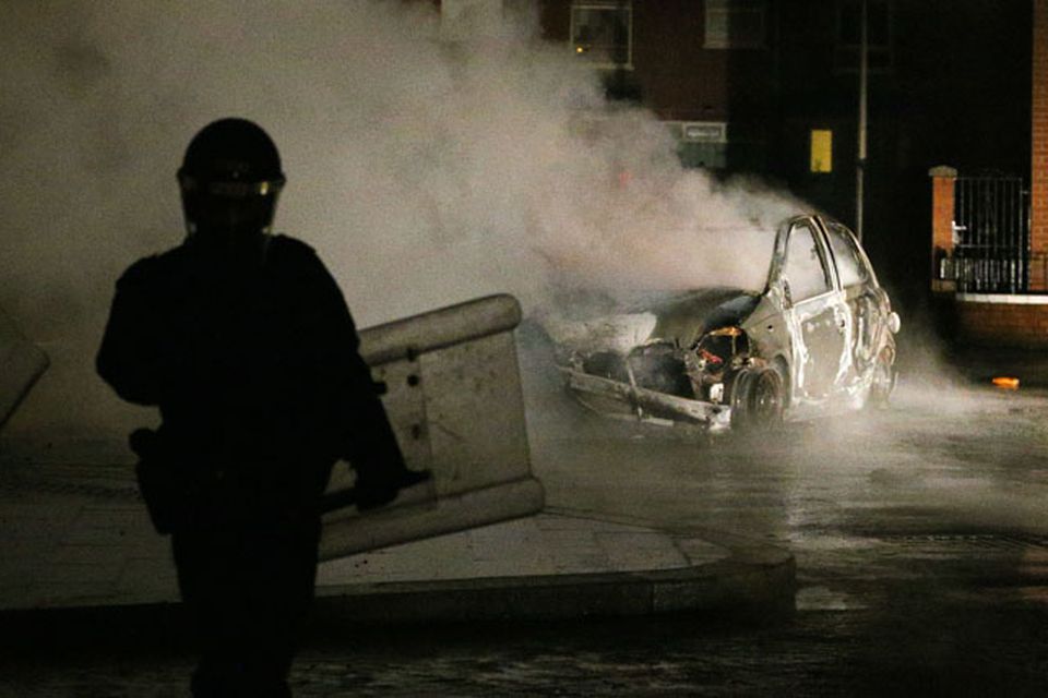 A car burns in the Castlereagh Street of east Belfast