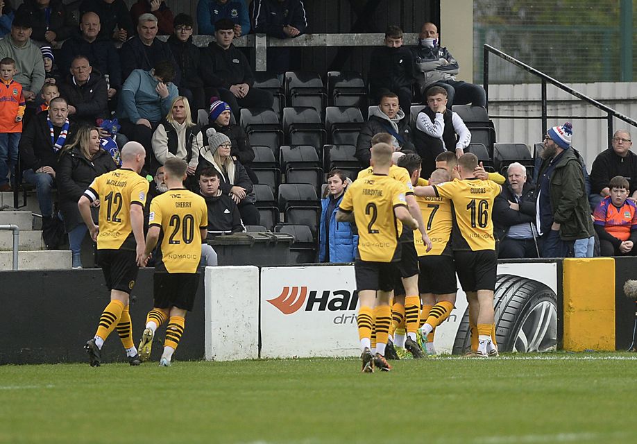 Joe Crowe celebrates his early goal with his Carrick Rangers teammates