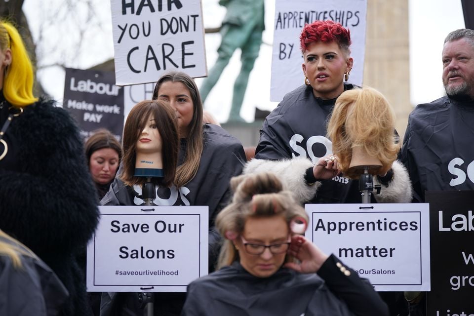 Hair and beauty sector owners and employees during a protest in Parliament Square, London to demand ‘urgent tax reform for the struggling sector’ (Yui Mok/PA)