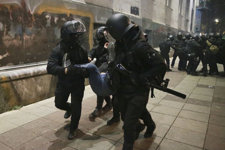 Police detain a demonstrator in Tbilisi (Zurab Tsertsvadze/AP)