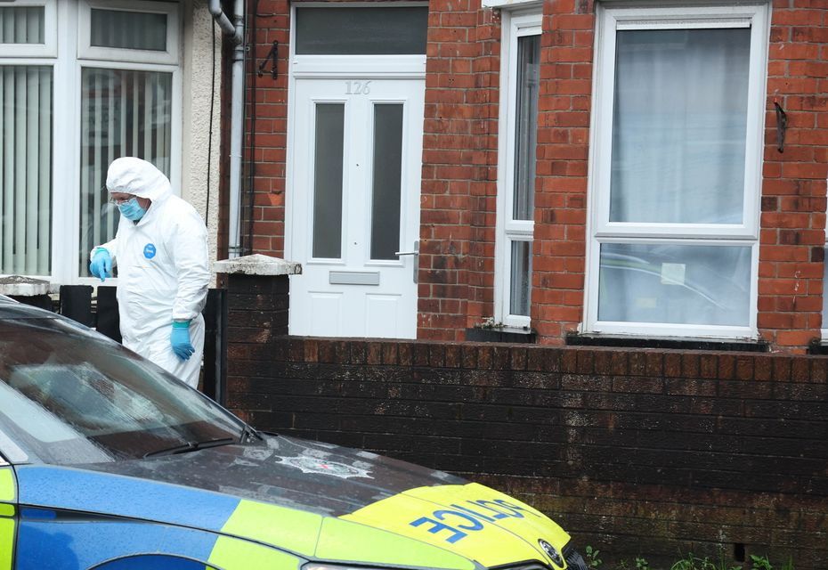 Police forensic officers at the scene of the murder of Mary Ward in Belfast. Photo: Alan Lewis