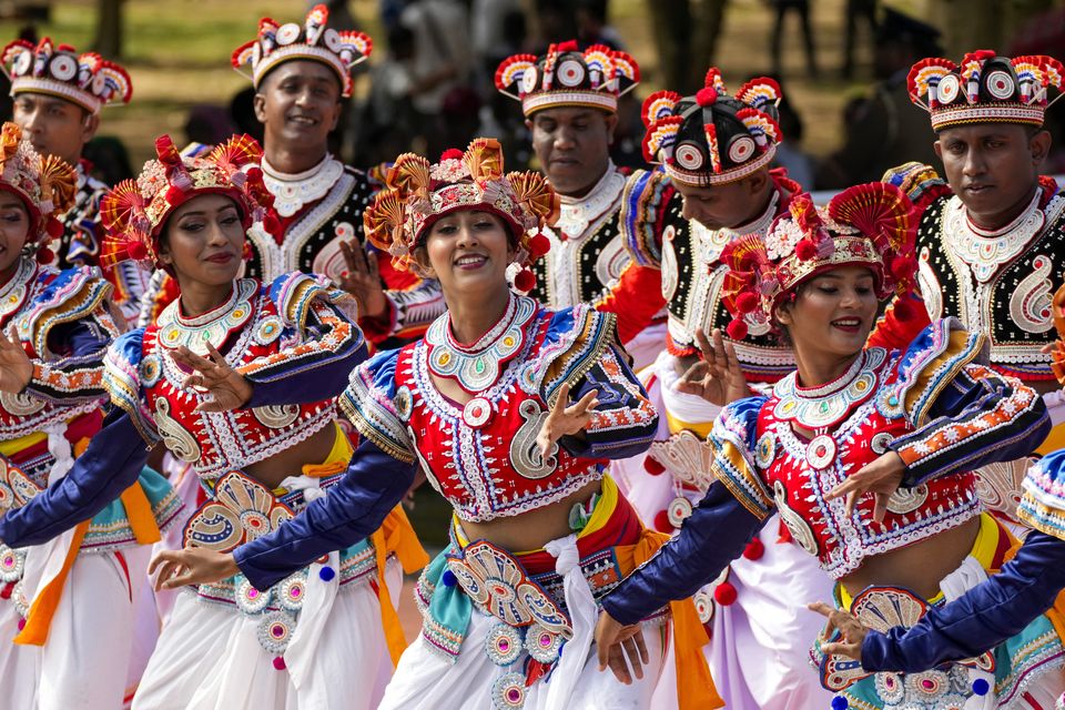 Sri Lankan traditional dancers perform during the country’s Independence Day ceremony (Eranga Jayawardena/AP)