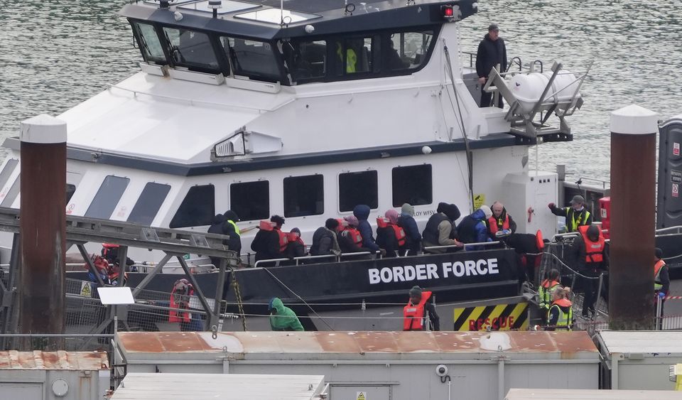 A group of people thought to be migrants are brought in to Dover, Kent, from a Border Force vessel following a small boat incident in the Channel (Gareth Fuller/PA)