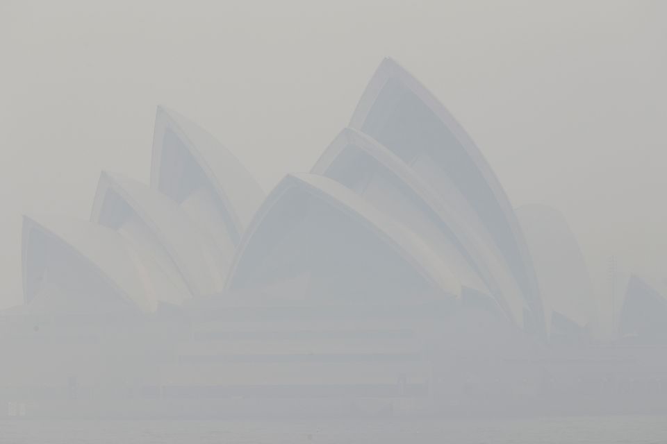 Thick smoke from wildfires shrouds the Sydney Opera House (Rick Rycroft/AP)