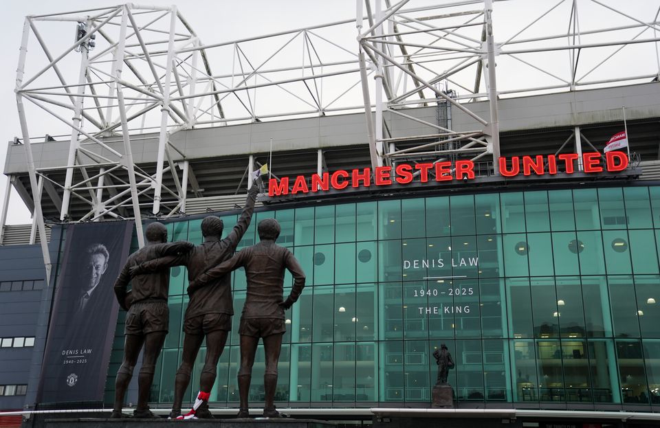 The funeral procession passed Old Trafford and the United Trinity statue (Martin Rickett/PA)