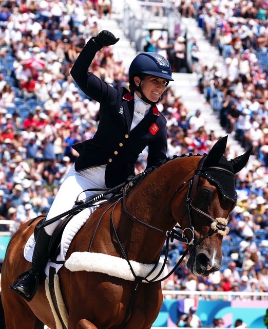 Laura Collett celebrated aboard London 52 following the eventing team jumping section (David Davies/PA)