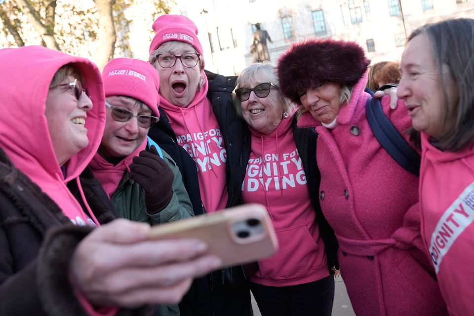 Supporters of Dignity in Dying listen outside the Houses of Parliament in Westminster to the result of the vote on the Terminally Ill Adults (End of Life) Bill. Pic: Stefan Rousseau/PA Wire