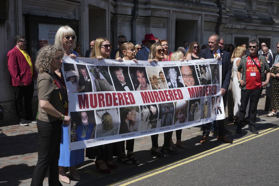 Victims and campaigners outside Central Hall in Westminster, London, after the publication of the Infected Blood Inquiry report (Jeff Moore/PA)