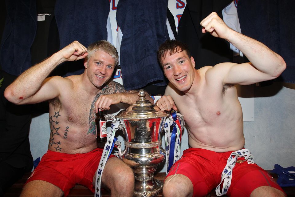 Linfield’s William Murphy and Albert Watson celebrate winning the Irish Cup after defeating Crusaders in the 2012 Final